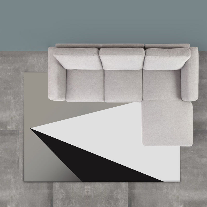 Modern living room rug in gray and white, color block triangle print, rug made of polyester, washable area rug