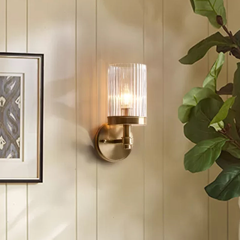 1-Light Wall Mounted Lamp Traditional Cylinder Transparent Glass Sconce Light in Brown/Gold over Bed