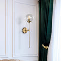Ball Shade Pencil-Arm Wall Lighting Postmodern Clear/Amber/Smoke Grey Glass Single Brass Wall Mounted Lamp