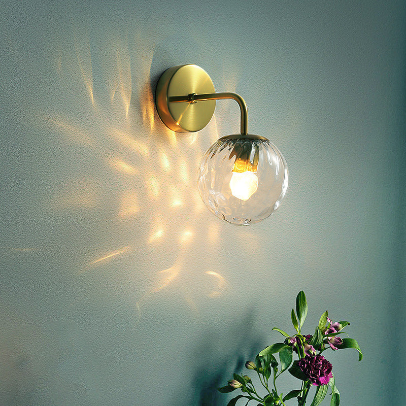 Ball Shaped Wall Lamp Minimalist Clear Rippling Glass 1-Light Bedroom Wall Mounted Lighting with Bent Arm in Black/Gold