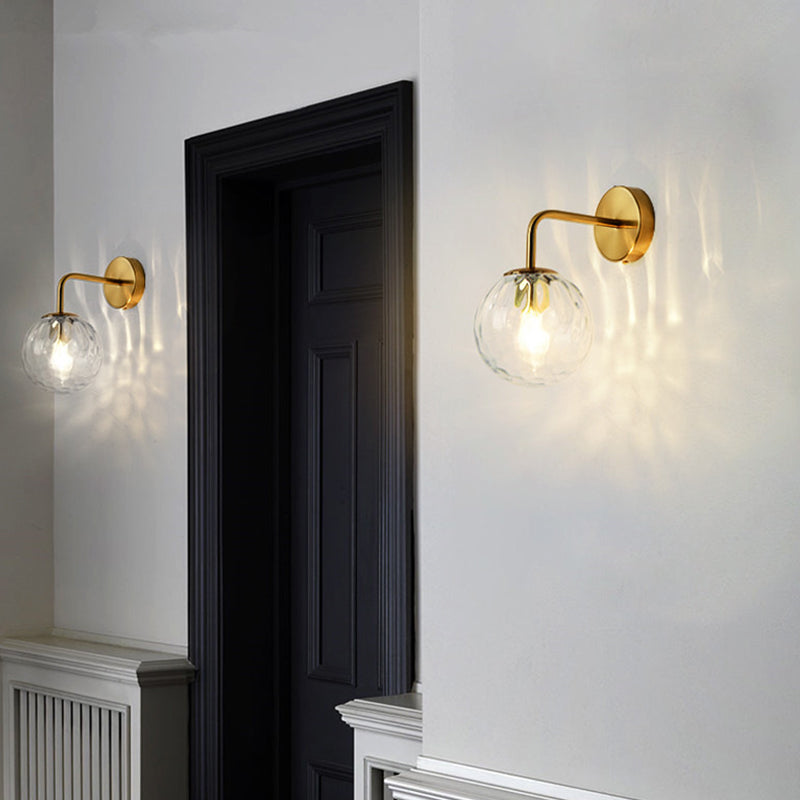 Ball Shaped Wall Lamp Minimalist Clear Rippling Glass 1-Light Bedroom Wall Mounted Lighting with Bent Arm in Black/Gold