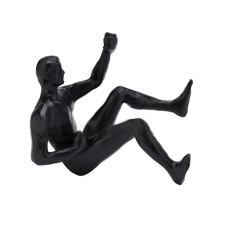 Climbing wall hanging statues
