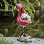 Flamingo relaxing garden gnome statue