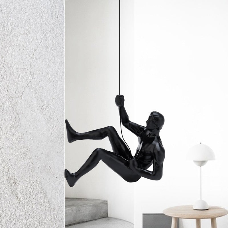 Climbing wall hanging statues