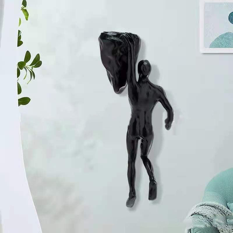 Climbing wall hanging statues