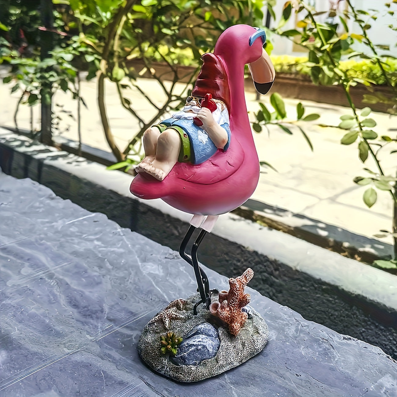 Flamingo relaxing garden gnome statue