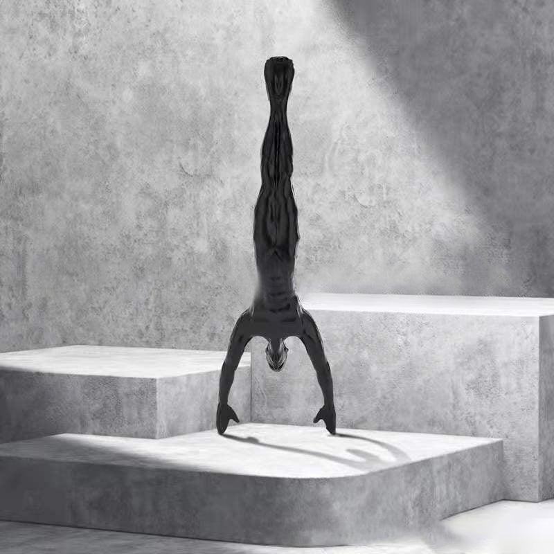 Climbing wall hanging statues