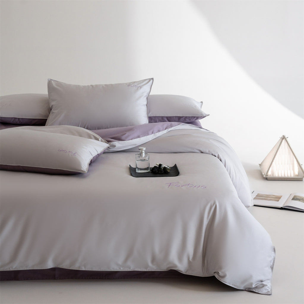 Reversible satin bedding set with fine tone-on-tone embroidery