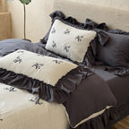 Reversible duvet cover in country house style with contrasting ruffle and fine branch embroidery