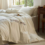 Embroidered cotton bedding set with floral border design and extra-soft percale quality