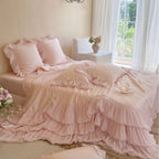 Romantic satin bedding and bedspread set with decorative ruffles and bows