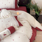Country-style bedding set with cherry embroidery, lace trim, and decorative neck roll