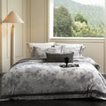 Cotton satin duvet cover set with delicate watercolor floral print, piped edge and matching pillowcases