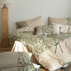 Embroidered cotton percale bedding set with quilted decorative plate and decorative ribbons
