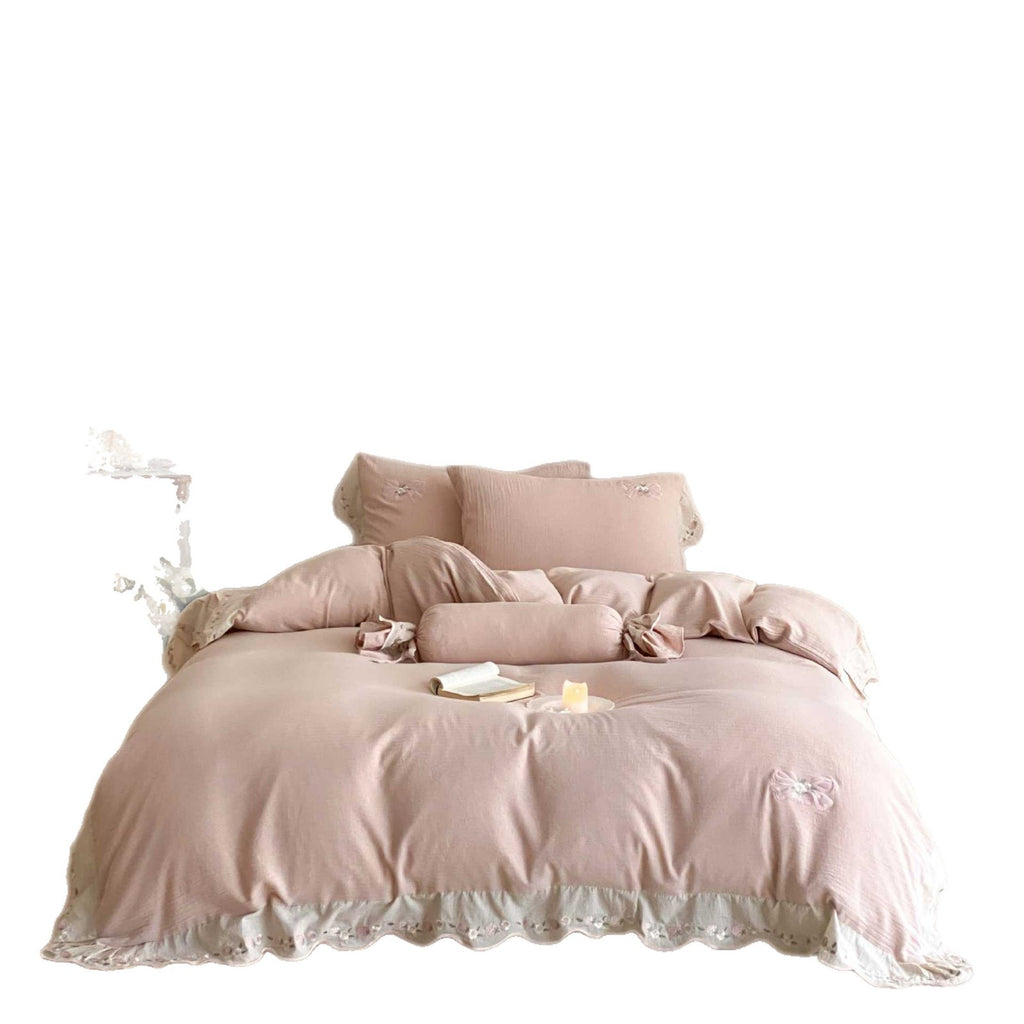 Bedding set made of linen-cotton blend with hand-stitched bow appliqués and gathered ruffle