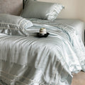 Luxurious satin bedding set with decorative borders and silky-smooth feel
