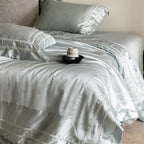 Luxurious satin bedding set with decorative borders and silky-smooth feel