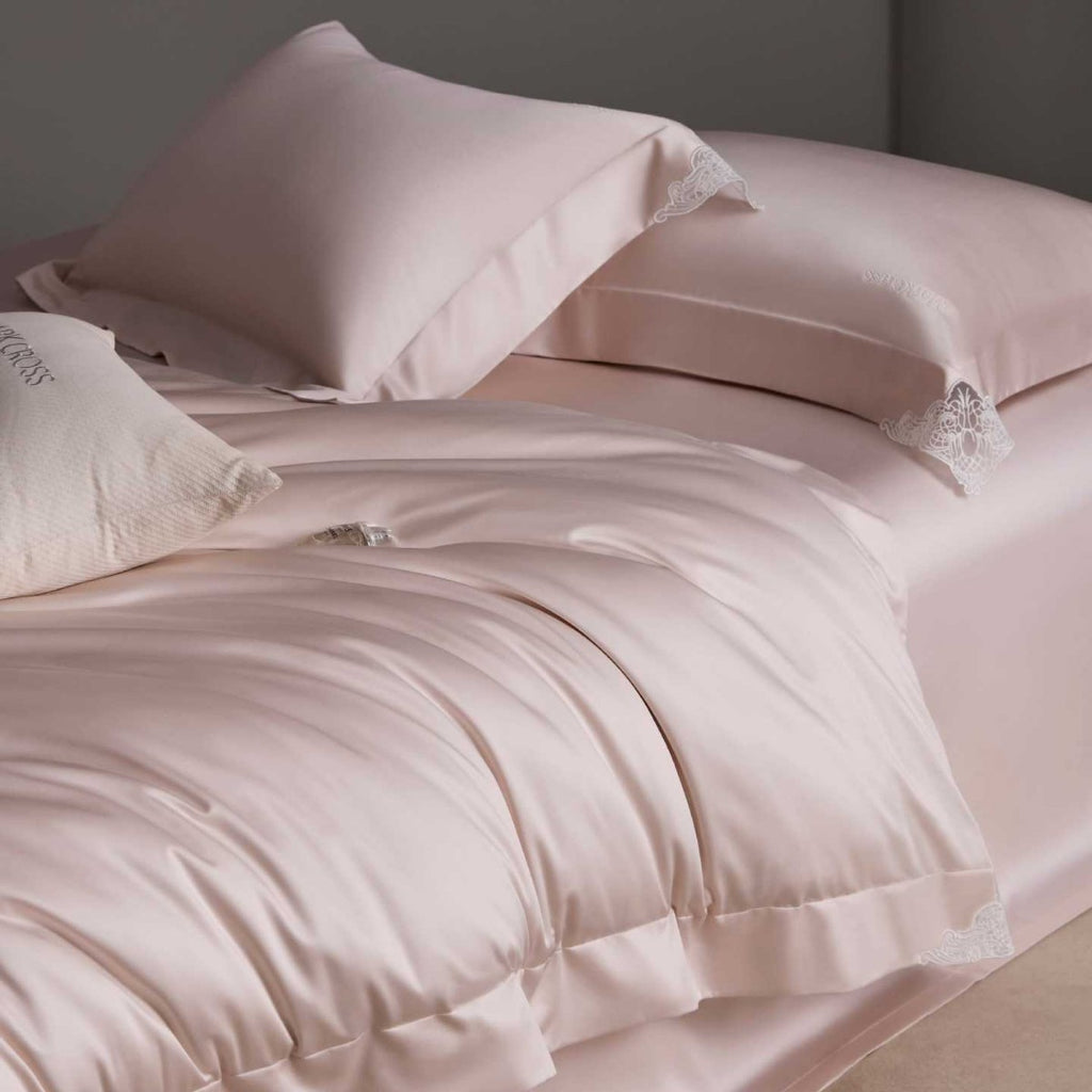 Luxurious cotton satin bedding set with delicate lace trim and hotel finish