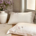 Luxurious embroidered cotton satin bedding set with delicate butterfly and flower appliqués