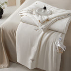 Silk bed cover made of microfiber with subtle embroidery and ultra-light fall