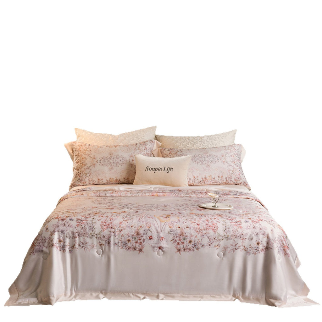 Luxurious cotton satin bed linen set with delicate floral print and quilted bedspread