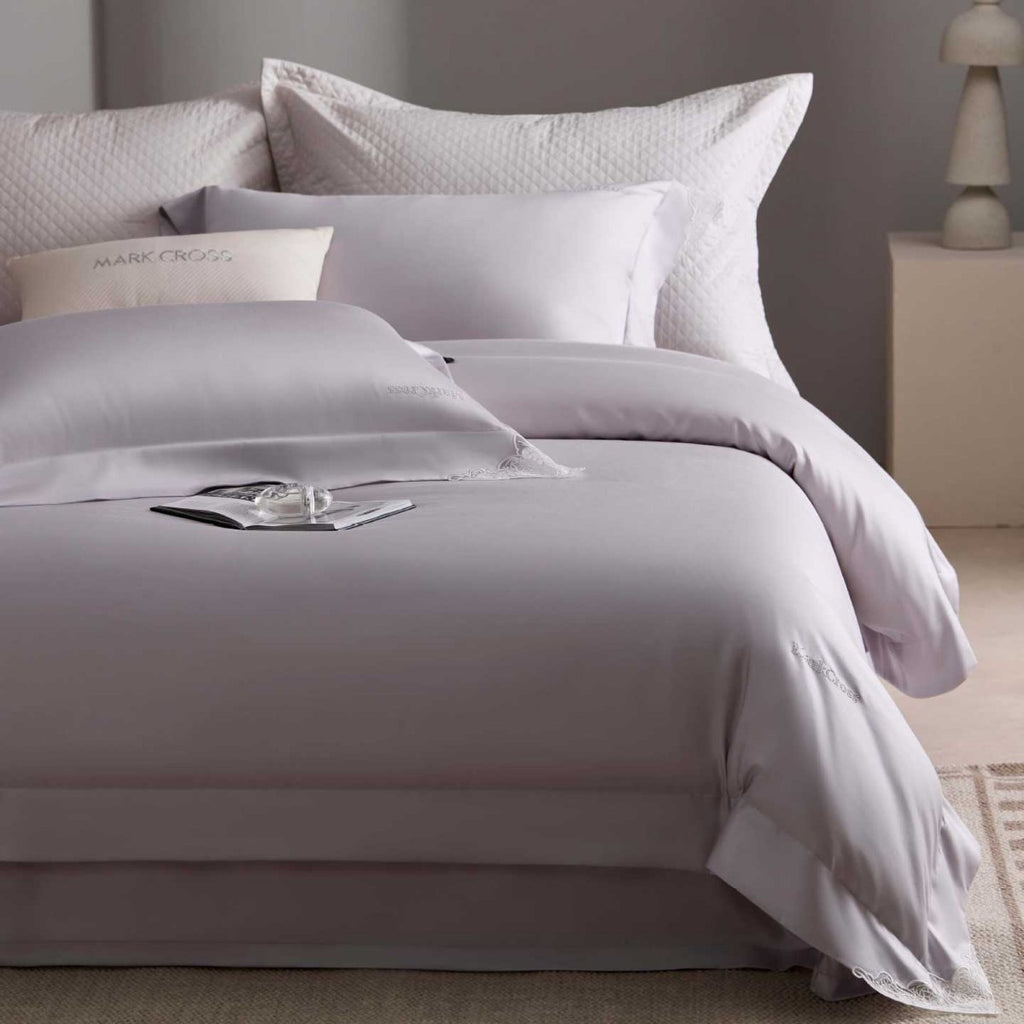 Luxurious cotton satin bedding set with delicate lace trim and hotel finish