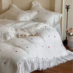 Bedding set in vintage look made of lightweight cotton muslin with lace ruffle and fine floral embroidery