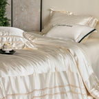 Luxurious satin bedding set with decorative borders and silky-smooth feel