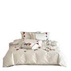 Embroidered cotton satin bedding set with floral applications and decorative border