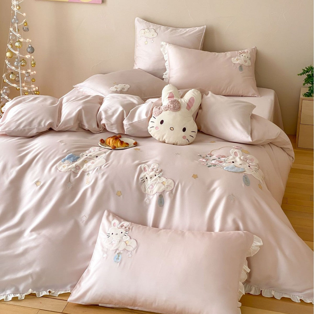 Playful children's bedding set made of silky-soft cotton satin with appliquéd bunnies and cuddly pillow