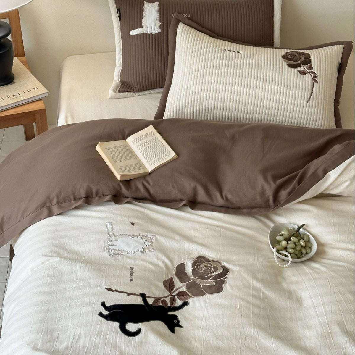 striped cotton bedding set with embroidered teddy bear appliqués and button closure