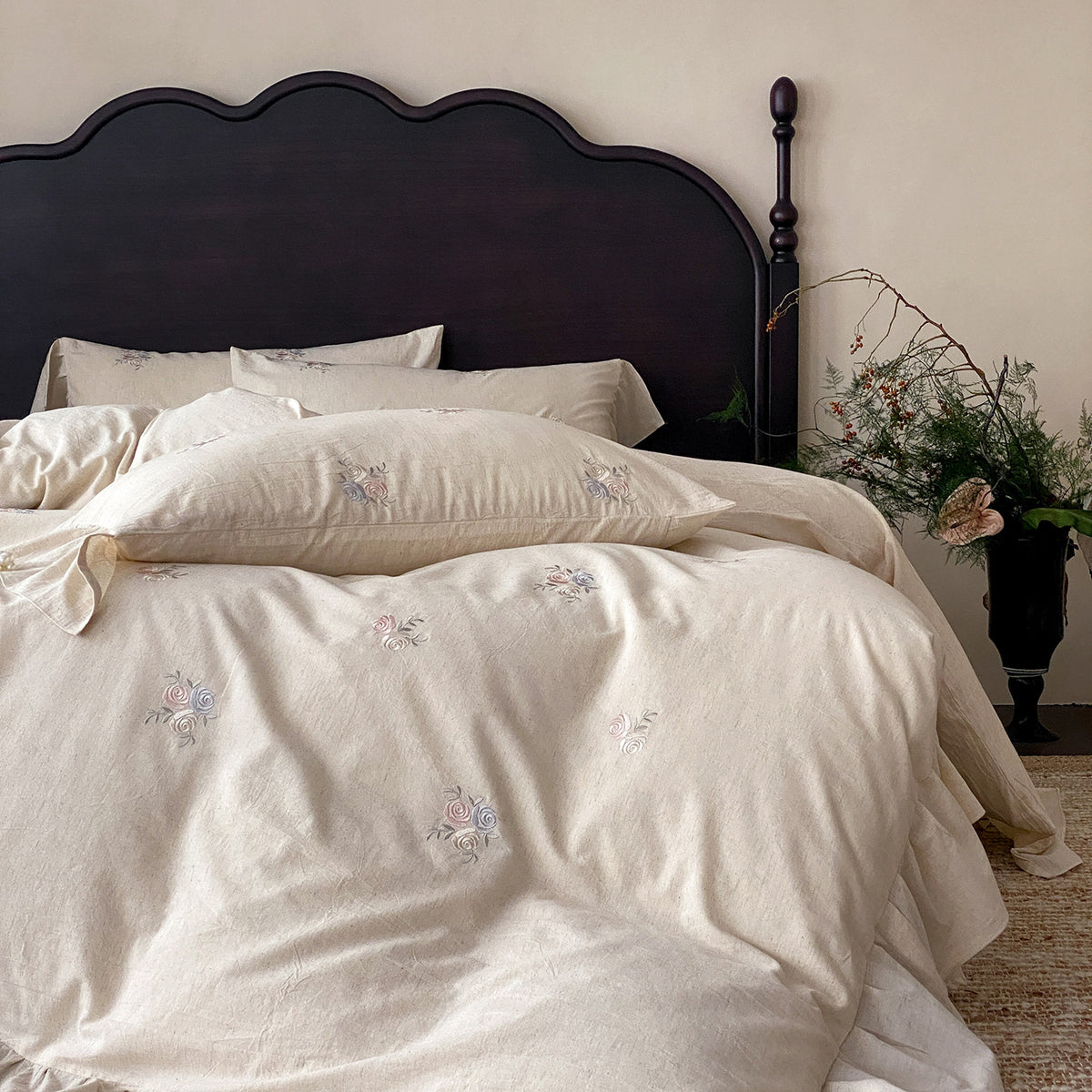 Vintage-inspired linen bedding set with fine rose embroidery and soft wash finish
