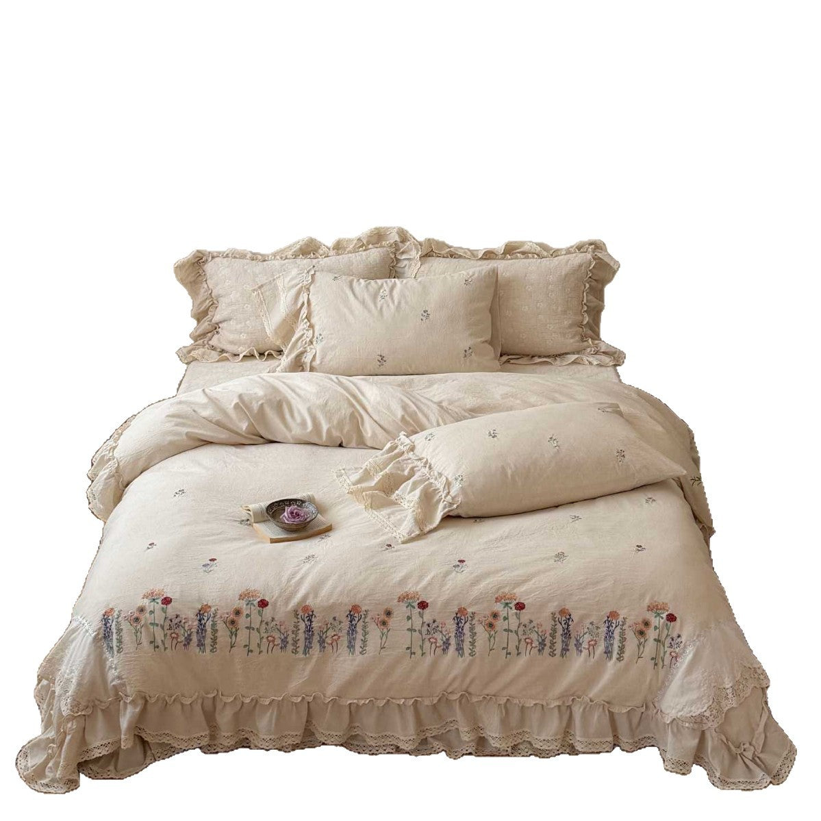 Romantic linen-cotton bedding set with embroidered floral border and ruffle