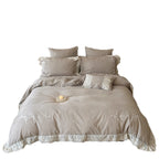 Vintage-inspired linen-cotton blend bedding set with floral chain stitch embroidery and lace trim