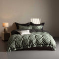 Reversible bedding set made of cotton satin with fine leaf pattern and contrasting piping