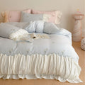 Playful cotton satin bedding set with ruffled bed skirt, floral embroidery, and frill cushion