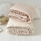 Cuddle blanket baby quilt with plush lining and bunny motif