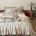 luxurious quilted bedspread set with embroidered lace and flounces