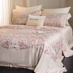 Luxurious cotton satin bed linen set with delicate floral print and quilted bedspread