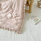Cuddle blanket baby quilt with plush lining and bunny motif