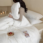 Quilted duvet with teddy applique and breathable microfiber filling