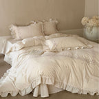 Vintage-inspired cotton bedding set with ruffles, delicate floral embroidery, and lace trim