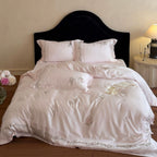 Elegant satin bedding set with fine floral embroidery and silky shiny drape