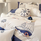 Maritime bedding set for children with embroidered sail and sea motifs made of cotton percale