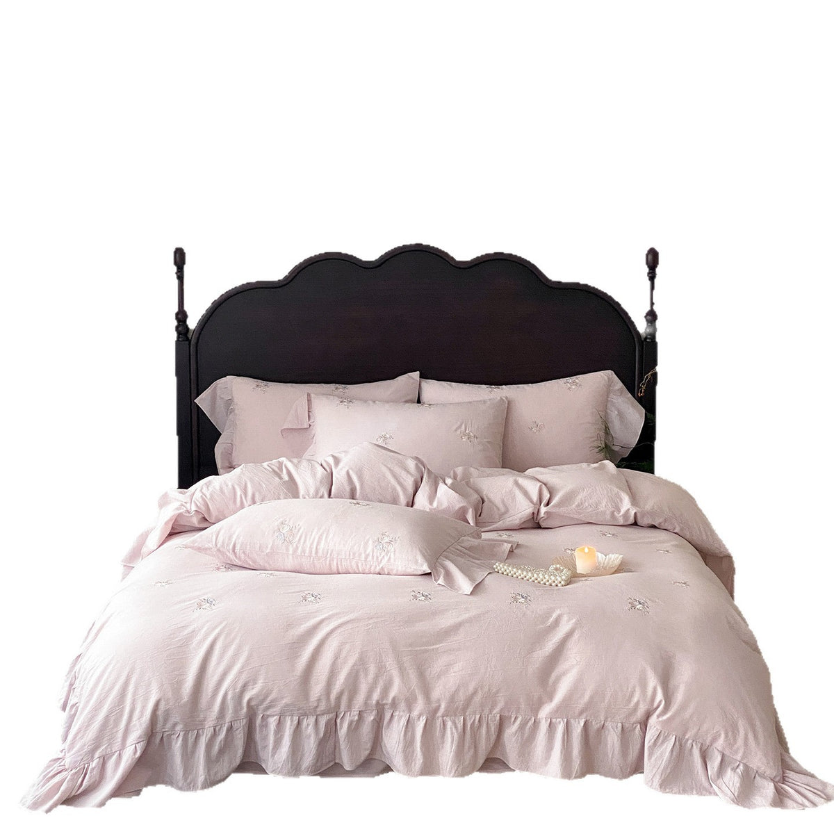 Vintage-inspired linen bedding set with fine rose embroidery and soft wash finish