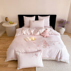 Romantic bedding set made of fine cotton satin with delicate embroidery and decorative cushion