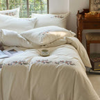 Embroidered cotton bedding set with floral border design and extra-soft percale quality