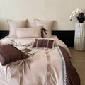 Elegant bedding set made of cotton satin with decorative pleats, bows, and lace trim