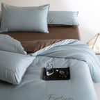 Reversible satin bedding set with fine tone-on-tone embroidery
