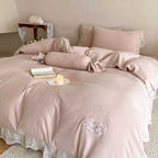 Bedding set made of linen-cotton blend with hand-stitched bow appliqués and gathered ruffle